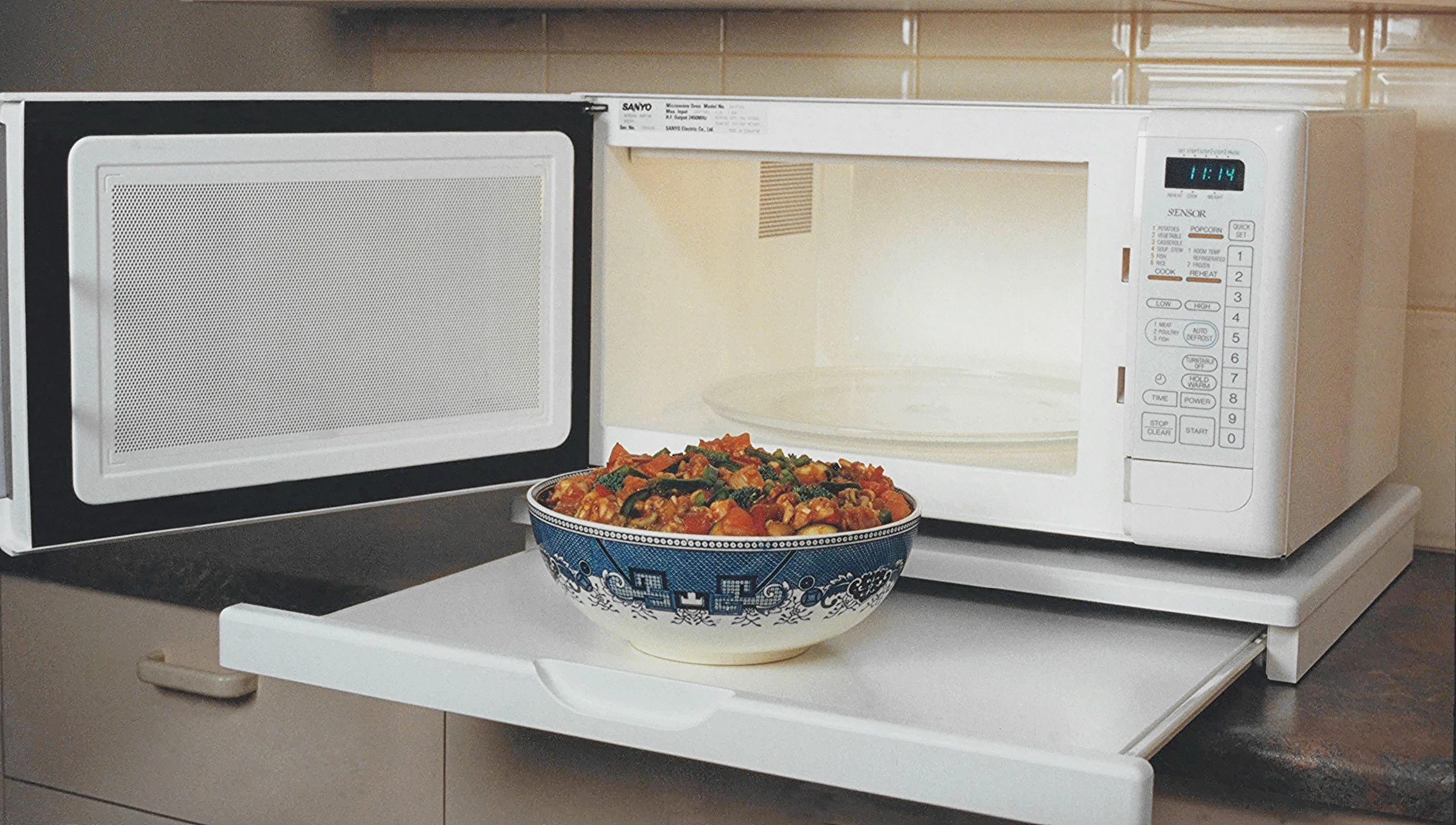 The microwave stealth shelf, a benchtop microwave shelf with pull out shelf